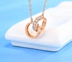 ByQueen | Eternal Love Rose Gold κολιέ 925 με δύο κύκλους και λευκά ζιργκόν